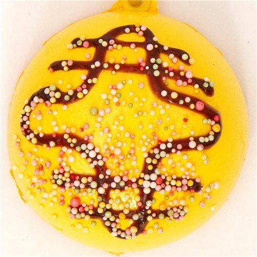yellow bread bun squishy charm with sprinkles