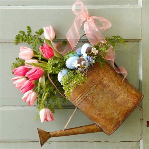 Nothing says better 'you are welcome', than a rusty watering can with flowers