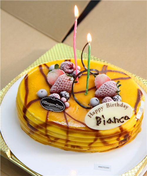 The mango ice cream cake tasted divine but was hard as stone