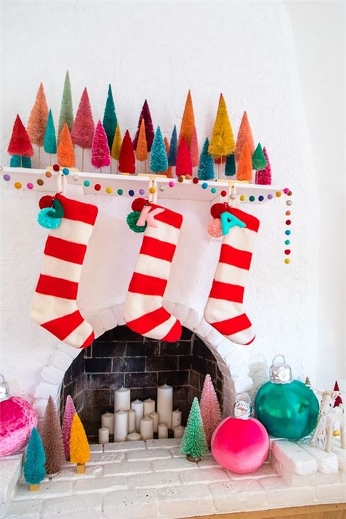 We love all the color and fun stockings in this picture, by Kelly Mindell of Studio DIY