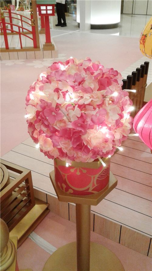 A small cherry blossom decoration with lights.