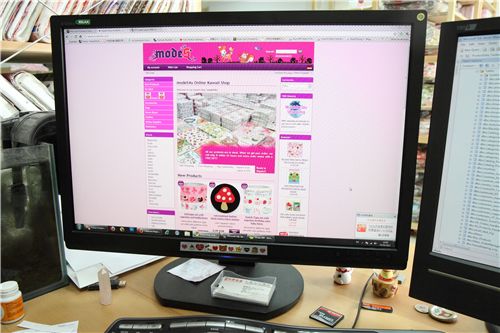 one of our computer monitors decorated with Rilakkuma tape