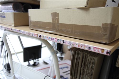 cute pink deco tape along the side of our packing table