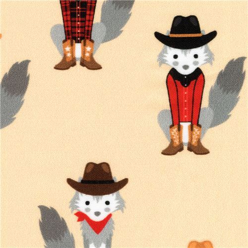 peach Robert Kaufman fabric with coyotes in cowboy outfits