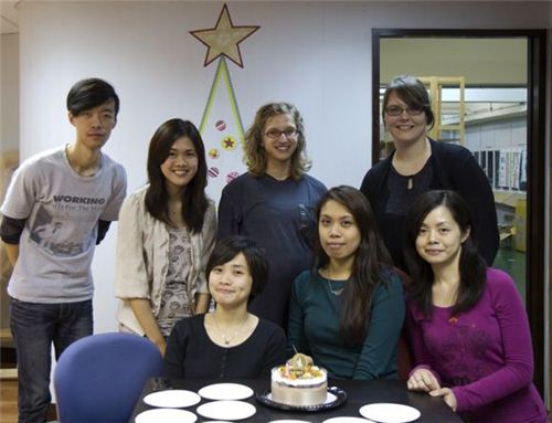 Our team with the birthday cake in front of our Washi Christmas tree