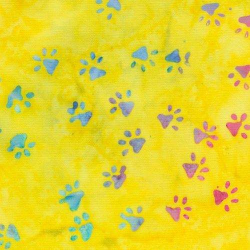 yellow batik Timeless Treasures fabric with paw prints