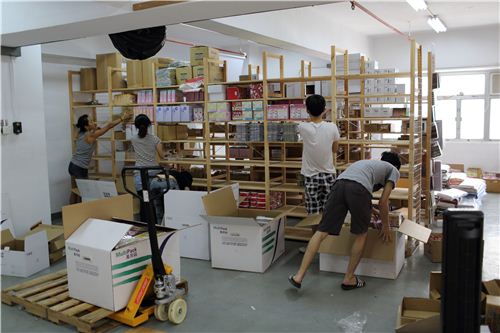One team is packing all the boxes in the old office