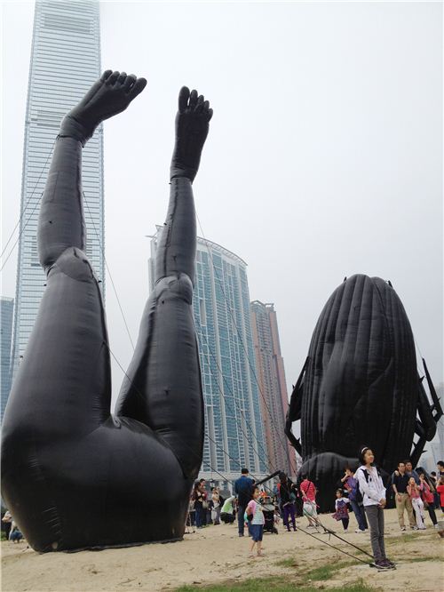 Next to the cockroach there was a pair of human legs