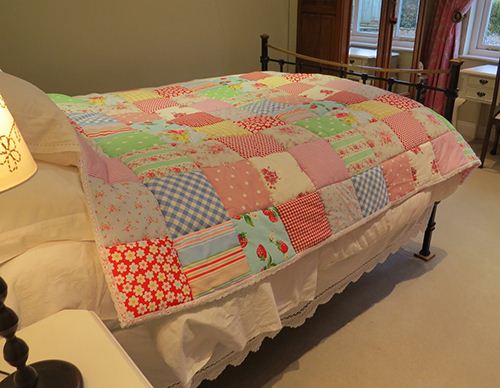 Stay warm with a delightful patchwork quilt. Courtesy of Rosie Buttons.