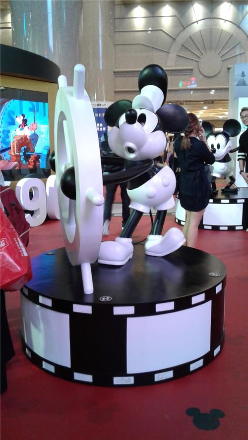 A statue of one of the older Mickey Mouse designs