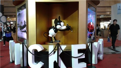 A rotating display showing off an older look of Mickey Mouse
