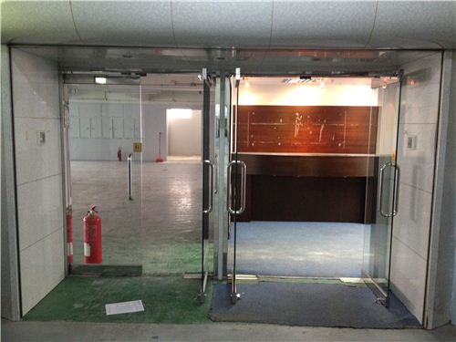 The new office even has two entry doors - office on the right, warehouse on the left