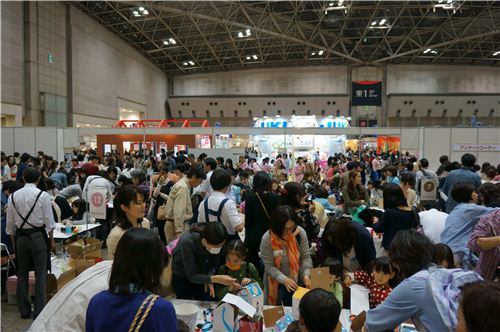Large exhibition halls with thousands of people who try many of the presented products