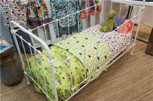 The monaluna fabrics used to decorate this children's bed look awesome